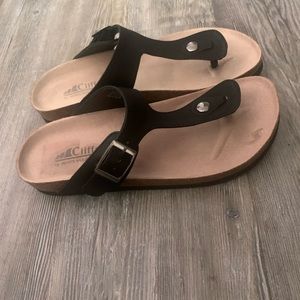 Cliffs by white mountain sandals